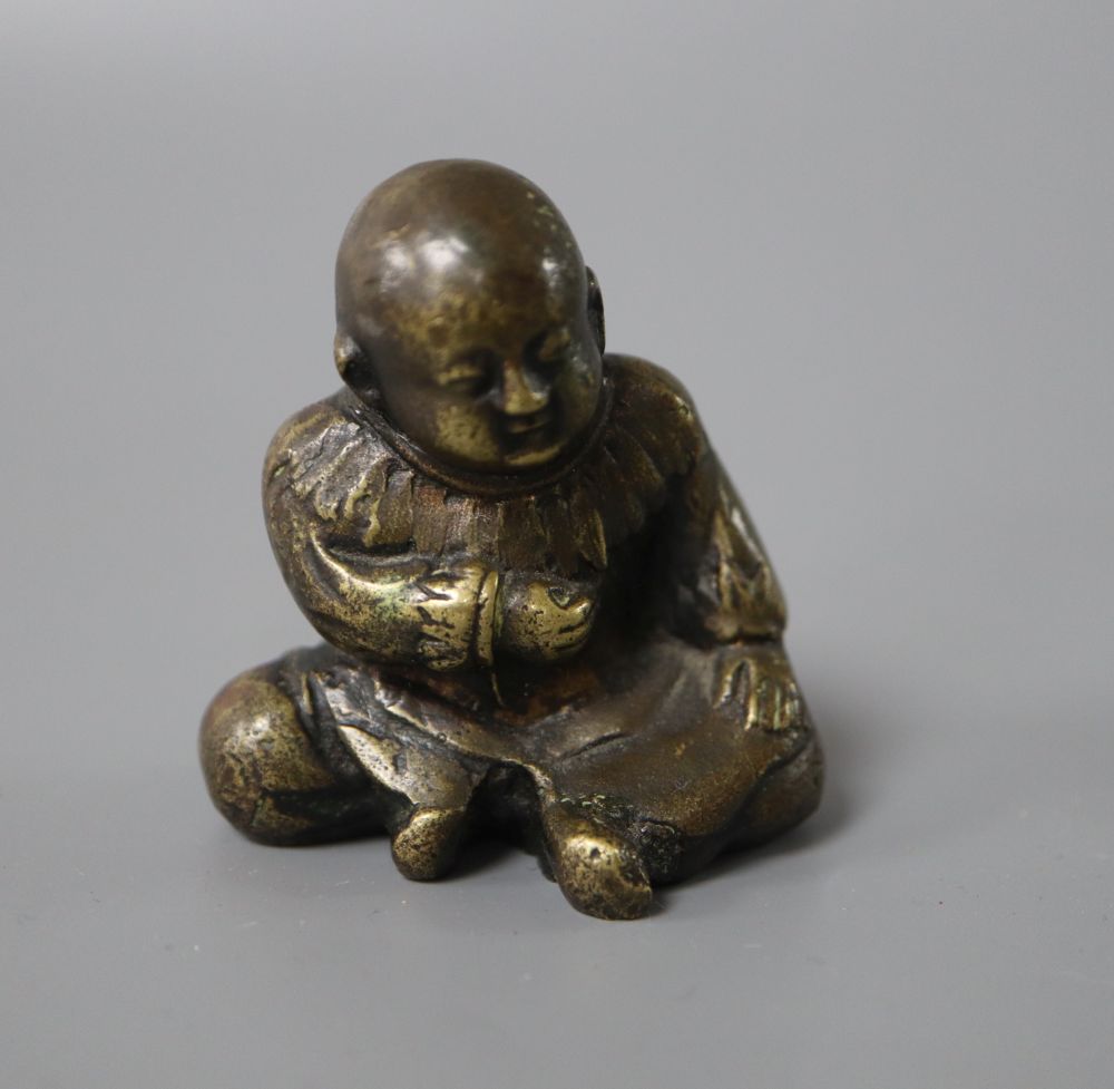 A Japanese bronze figure of a seated boy, height 5cm